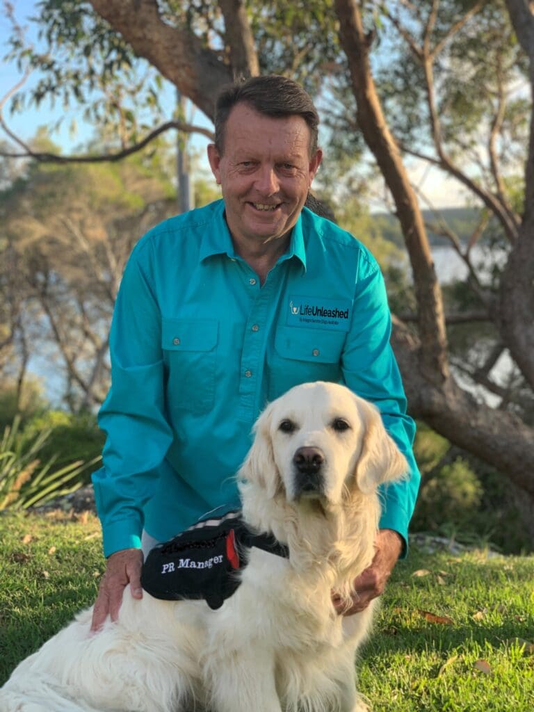 Life Unleashed's National Partnerships Manager Richard Lord with PR Manager Quentin the service dog.